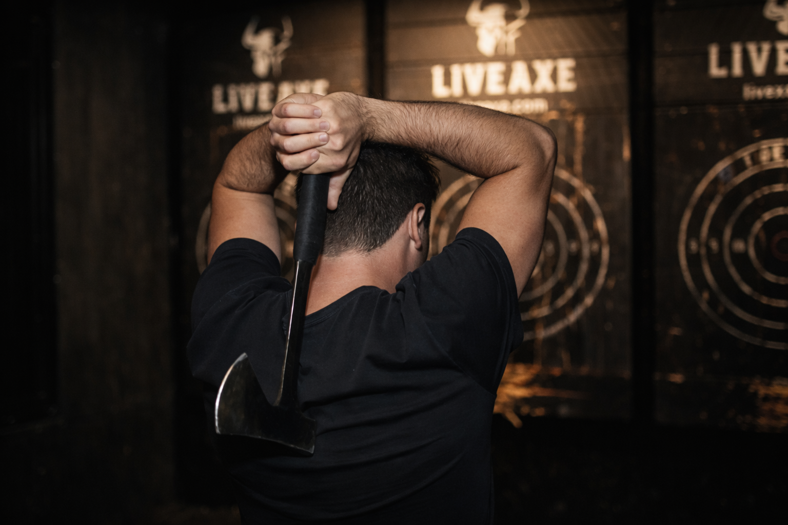 Man throwing axe at Live Axe NYC